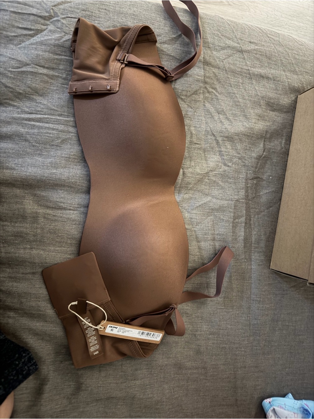 SKIMS Seamless Strapless Molded Bra in Brown
